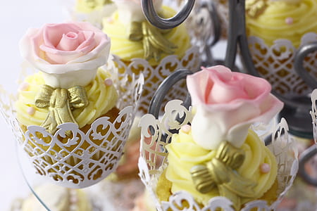rose-themed cupcakes on white steel holder thumbnail