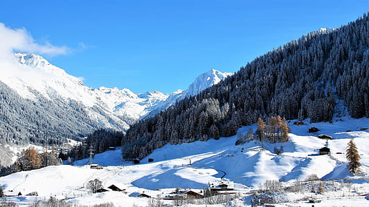 concrete house surrounded by snow filled trees mountain thumbnail
