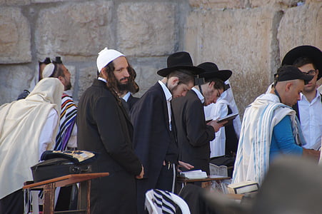 group of people standing on front of wall thumbnail