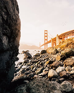 rock formations near body of water thumbnail