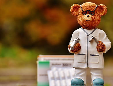 focus photo of doctor bear figurine thumbnail