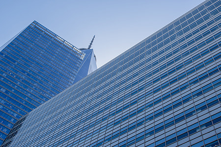high rise building under blue sky low angle photography thumbnail