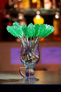 selective focus photo of green ornament inside clear glass bottle thumbnail