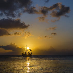 silhouette of galleon ship at sunset thumbnail
