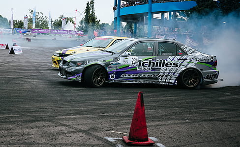 Gray and White Racing Car Drifting thumbnail