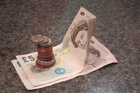 two 5 pounds banknotes and coins thumbnail