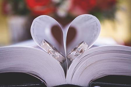 two silver-colored rings on book page thumbnail