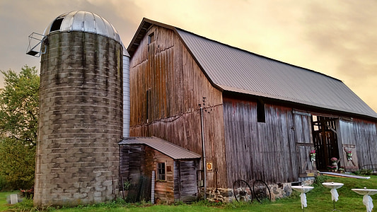 brown barn under cloudy sky thumbnail