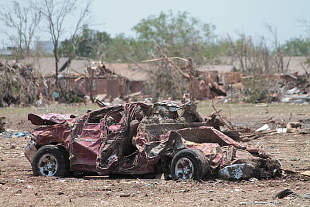 wreck red car near green leaf tree thumbnail