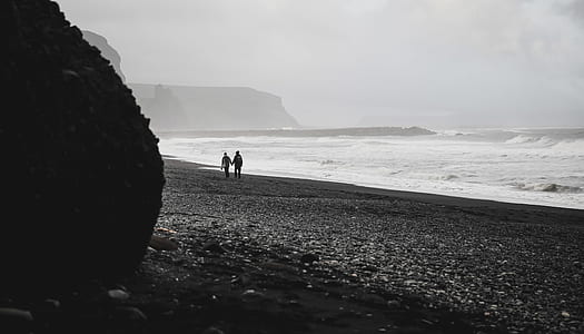 two person walking on seashore thumbnail