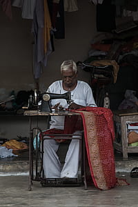 man wearing white shirt and pants treading red textile thumbnail