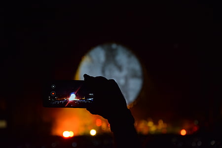 selective focus photography of person taking photo thumbnail