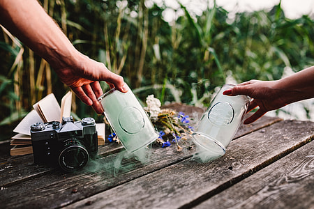 Colorful smoke bomb, book and vintage camera thumbnail