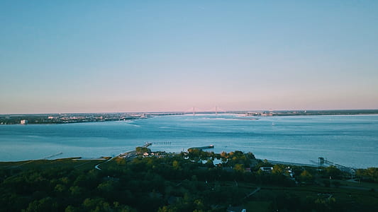 high-angle photography of buildings near body of water thumbnail