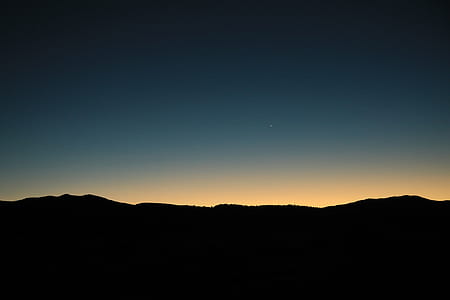 silhouette photography of mountain thumbnail