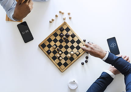 two persons playing chess thumbnail