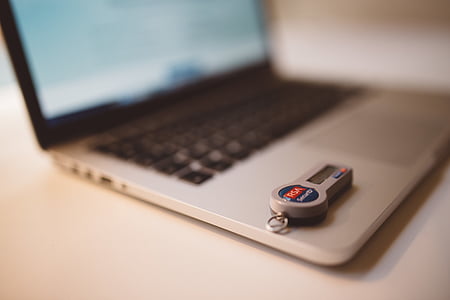 gray laptop on white wooden surface thumbnail