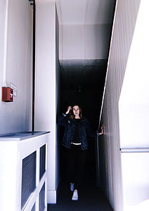 woman standing at hallway while taking selfie thumbnail