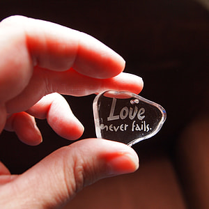 person holding clear laser cut pendant thumbnail