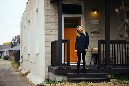 woman standing outside the house thumbnail
