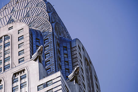 gray concrete building under clear blue sky thumbnail