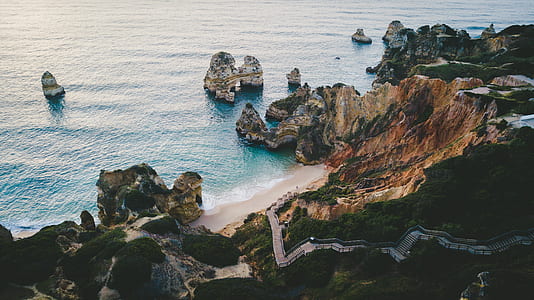 aerial photography of seashore and mountains thumbnail