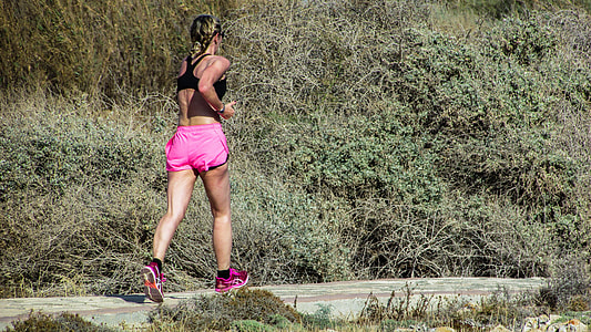 woman jogging on concrete floor thumbnail