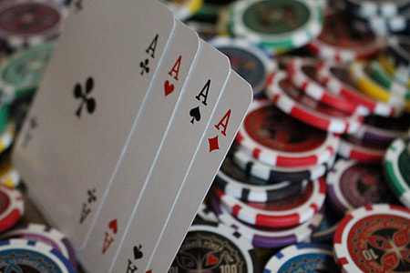 four Ace playing cards on poker chips thumbnail