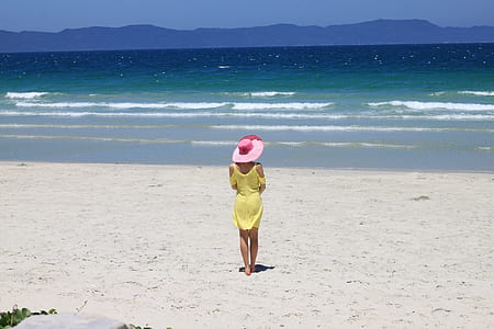 woman standing in front of seashore thumbnail