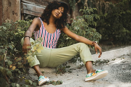 Photo of a Woman Sitting on Pavement thumbnail
