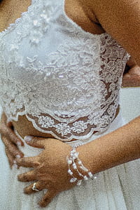 woman wearing white sleeveless crop-top and skirt thumbnail