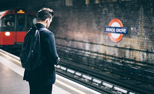 man standing on subway thumbnail