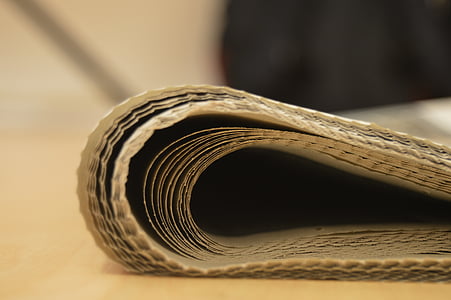 selective focus photography of bend brown pad on brown surface thumbnail