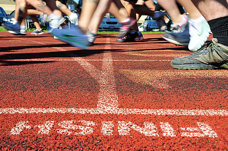 group of people running on finish line thumbnail