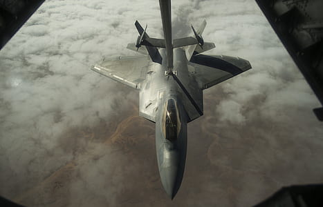 gray fighting plane above white clouds thumbnail