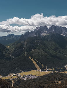 green mountain near village at daytime thumbnail