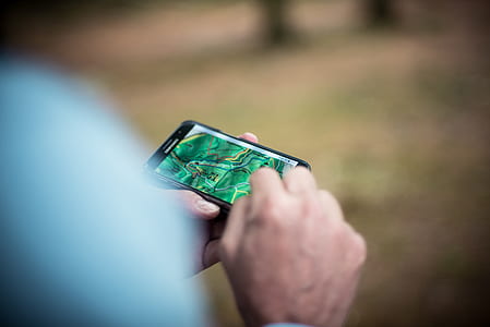 person using black smartphone thumbnail