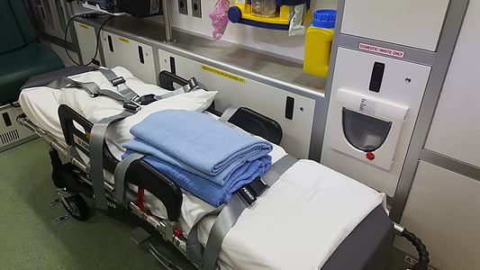 blue blanket on stretcher beside equipment thumbnail
