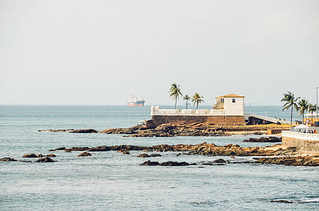 white and brown concrete house on island thumbnail