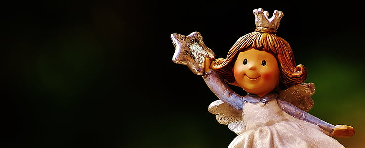 girl angel holding star figurine closeup photo thumbnail