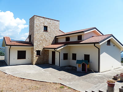 white, brown, and black house during daytime thumbnail