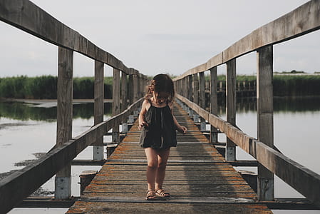 girl walking on bridge thumbnail