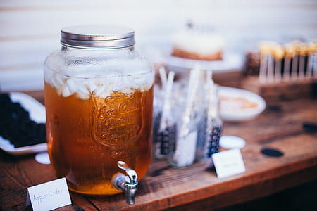 clear glass mason beverage dispenser on top of table thumbnail