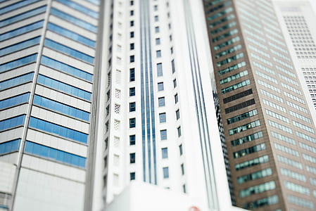 low-angle photo of gray and brown high-rise buildin thumbnail