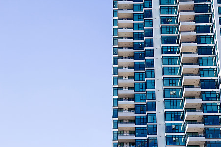 white and blue painted building under the clear sky during daytime thumbnail