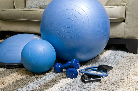 assorted exercise equipment on fabric rug thumbnail
