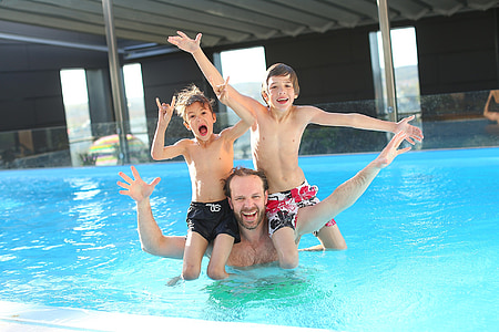 man with children swimming in the pool thumbnail