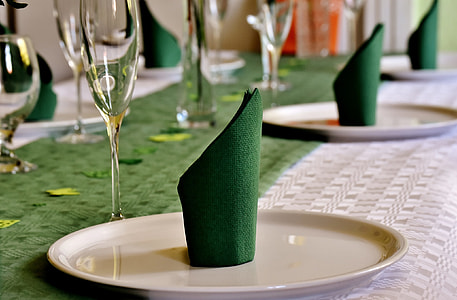 green table cloth on white ceramic plate thumbnail
