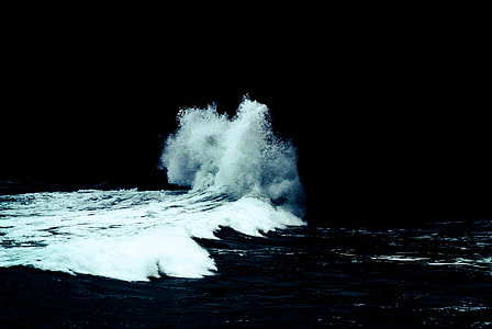photo of ocean wave crashing on rocks thumbnail