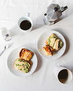 two sliced sandwiches on plate thumbnail
